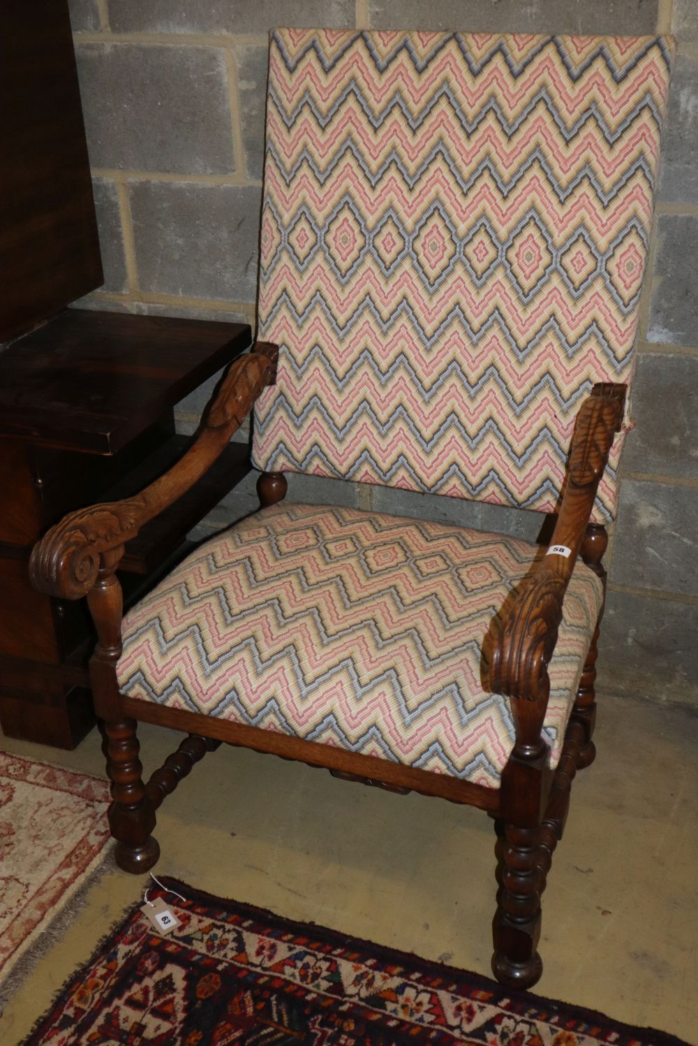 A Louis XIV style carved oak fauteuil, W.60cm, D.66cm, H.176cm